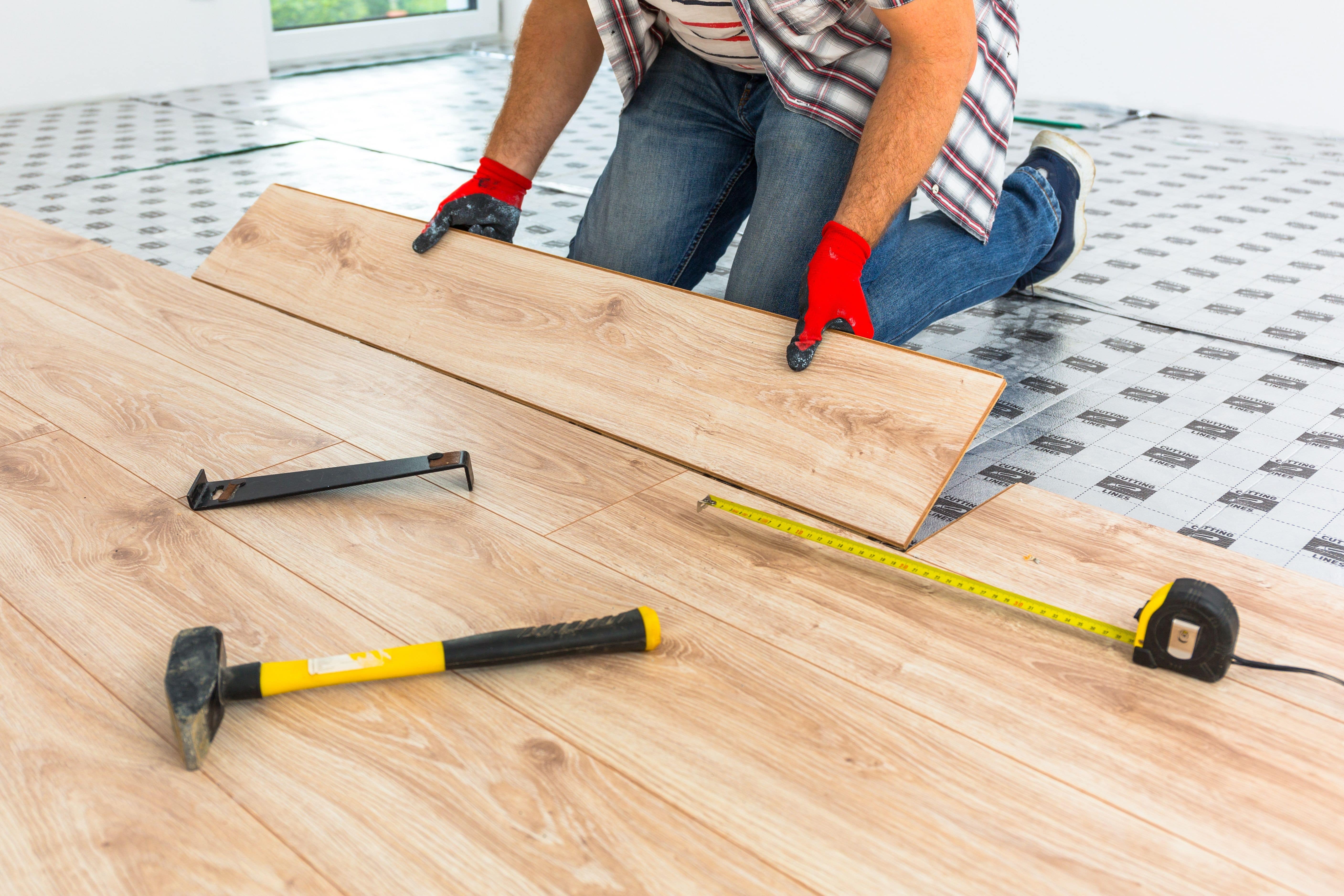 Man Replacing Flooring